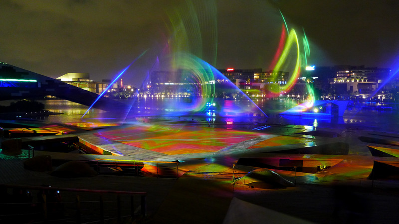 The laser lights make a difference in the music fountain.